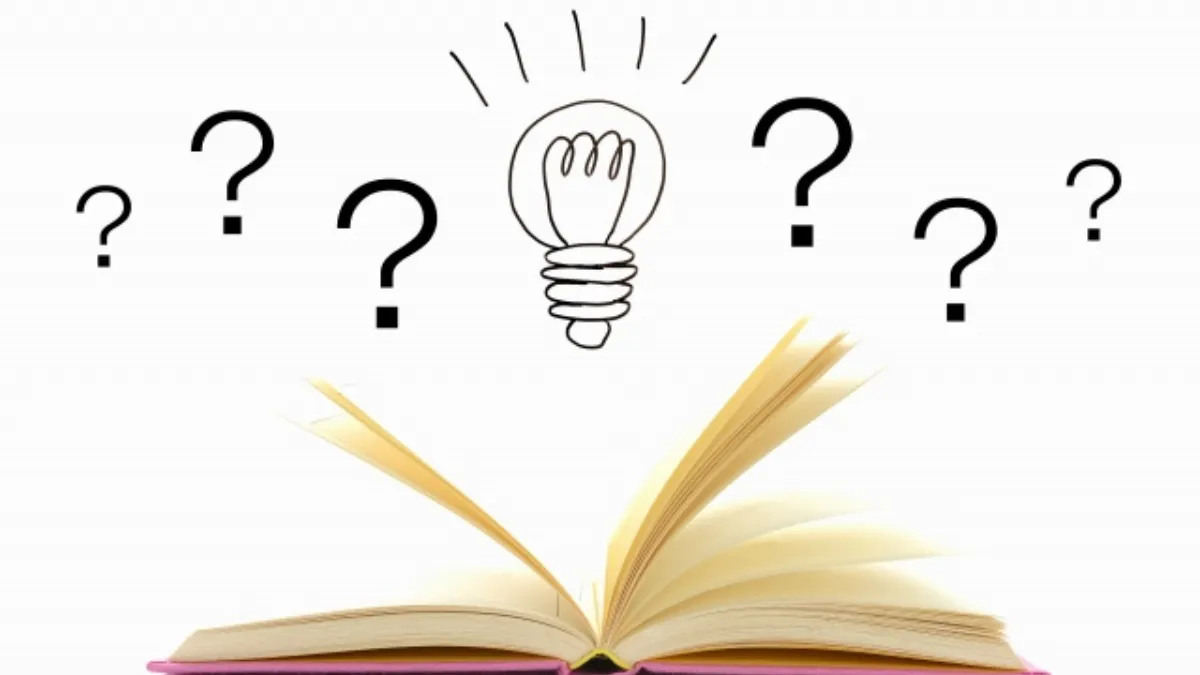 本の上に電球と？マークが飛んでいる